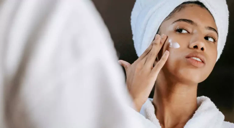 Person applying moisturiser as part of a daily skincare routine